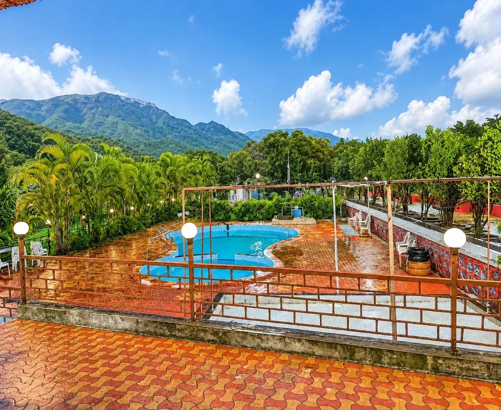 Beautiful daytime view of Kunal Resort Neral swimming pool and mountains
